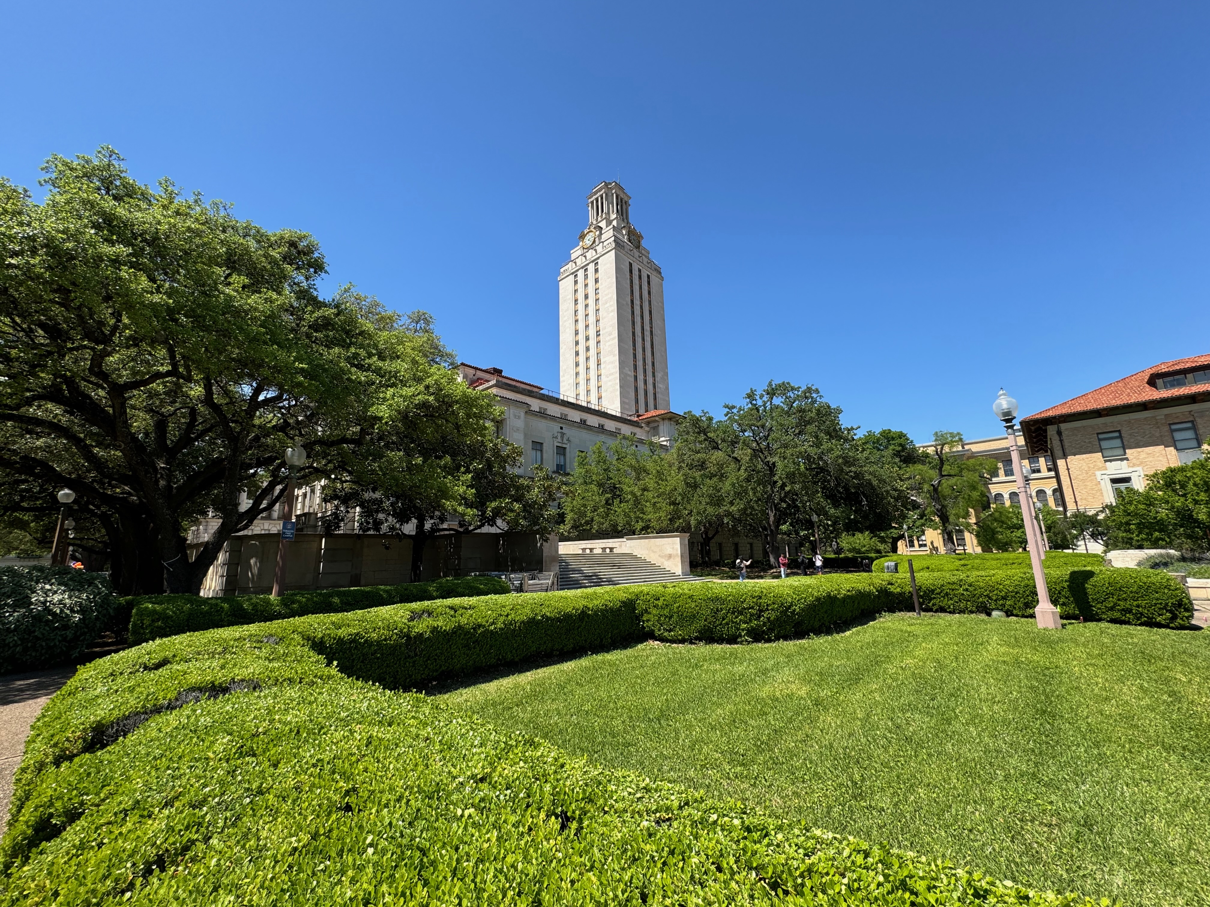 UT Tower rising above the campus grounds on a clear day