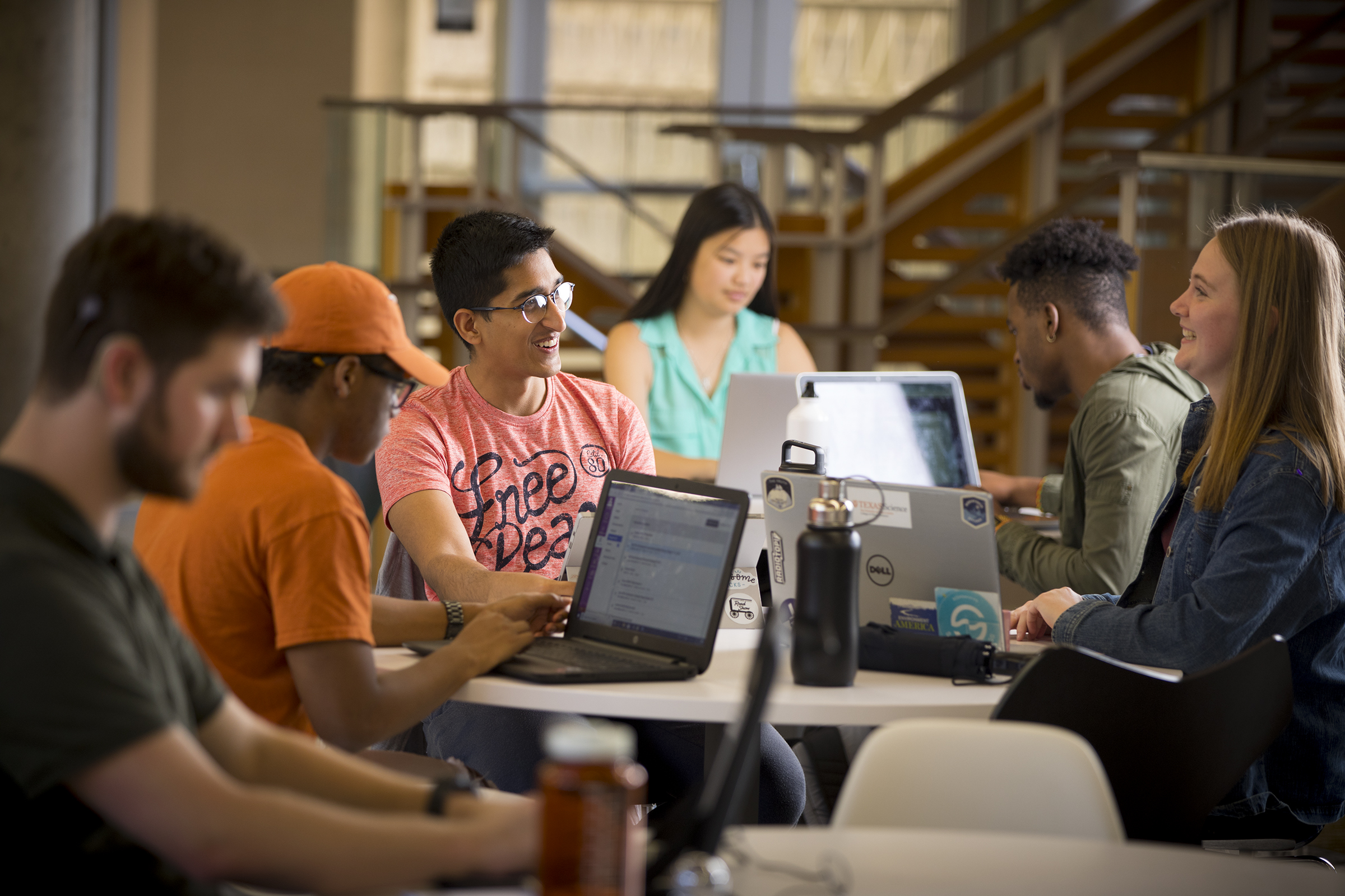 UT Austin community members collaborating in a campus setting